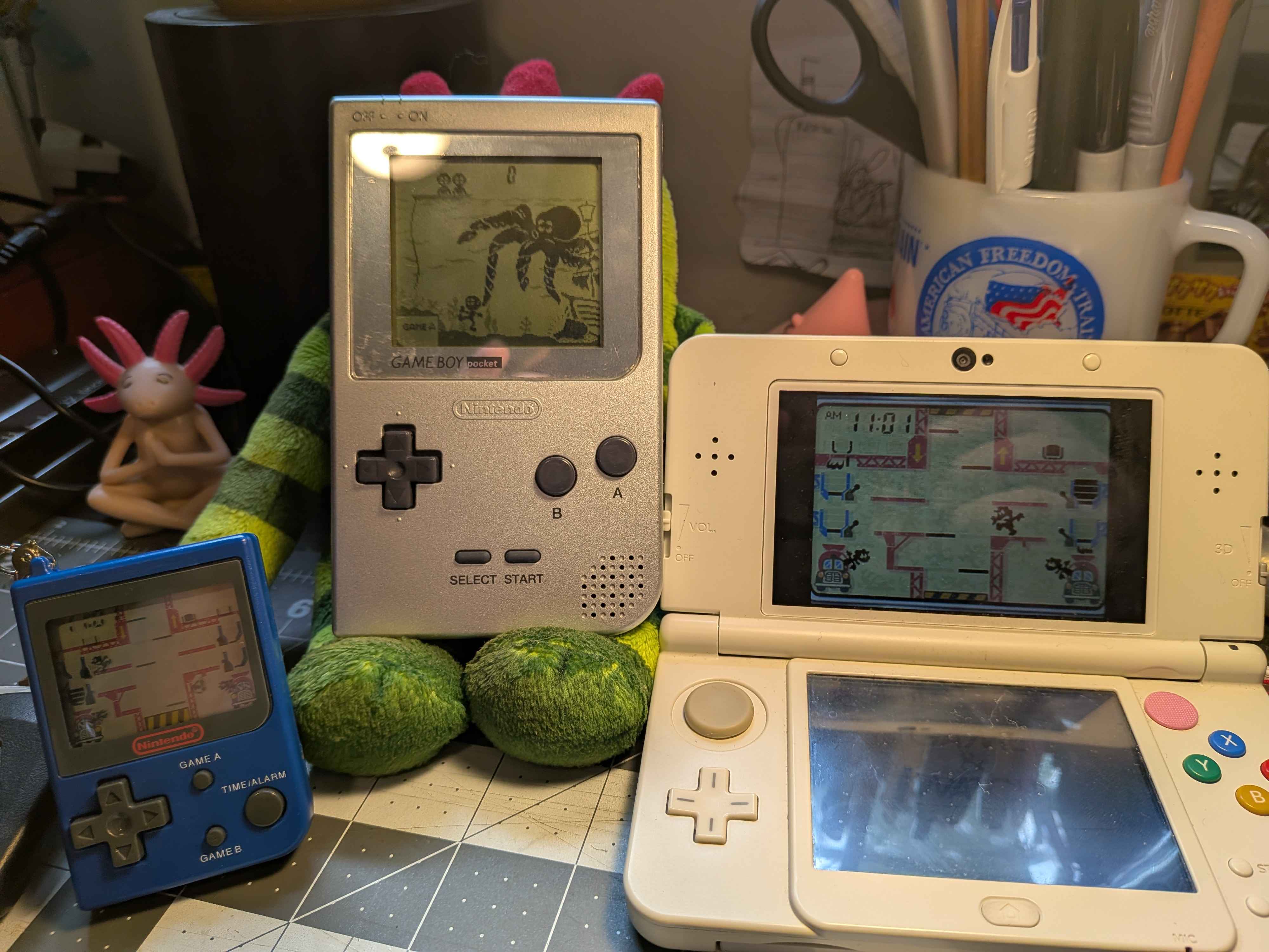 a 3DS, Game Boy Pocket, and the keychain all running at the same time