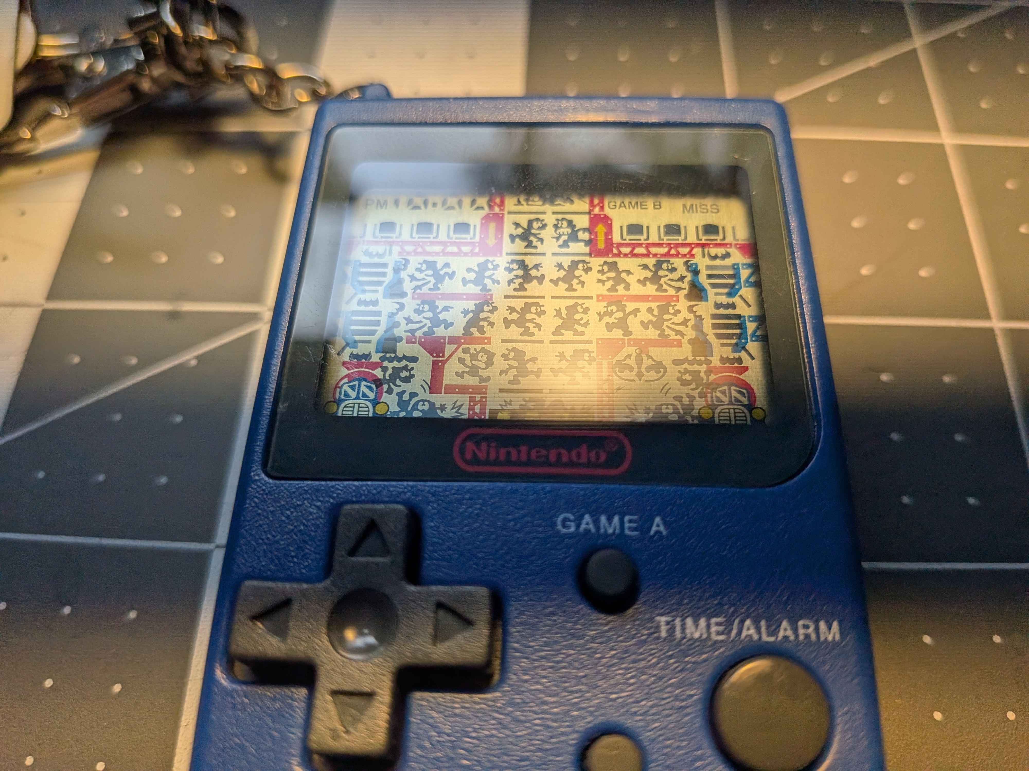 The keychain posed at an angle, all of the LCD cells showing